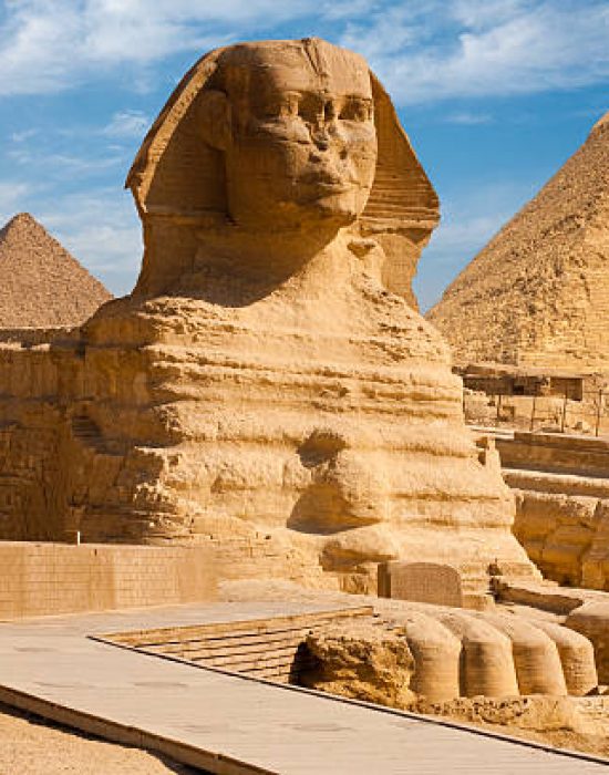 A beautiful profile of the Great Sphinx including the pyramids of Menkaure and Khafre in the background in Giza, Cairo, Egypt